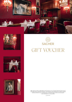 Sacher gift voucher featuring opulent dining room with red walls, chandeliers, fireplace, and fine art decor