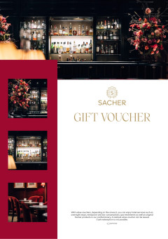 Stylish Sacher Bar with red and green velvet seating and fireplace at Hotel Sacher Salzburg.